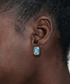 14K Yellow Gold Blue Topaz Emerald Cut Earring With Flower Pattern J-Back and Black Enamel